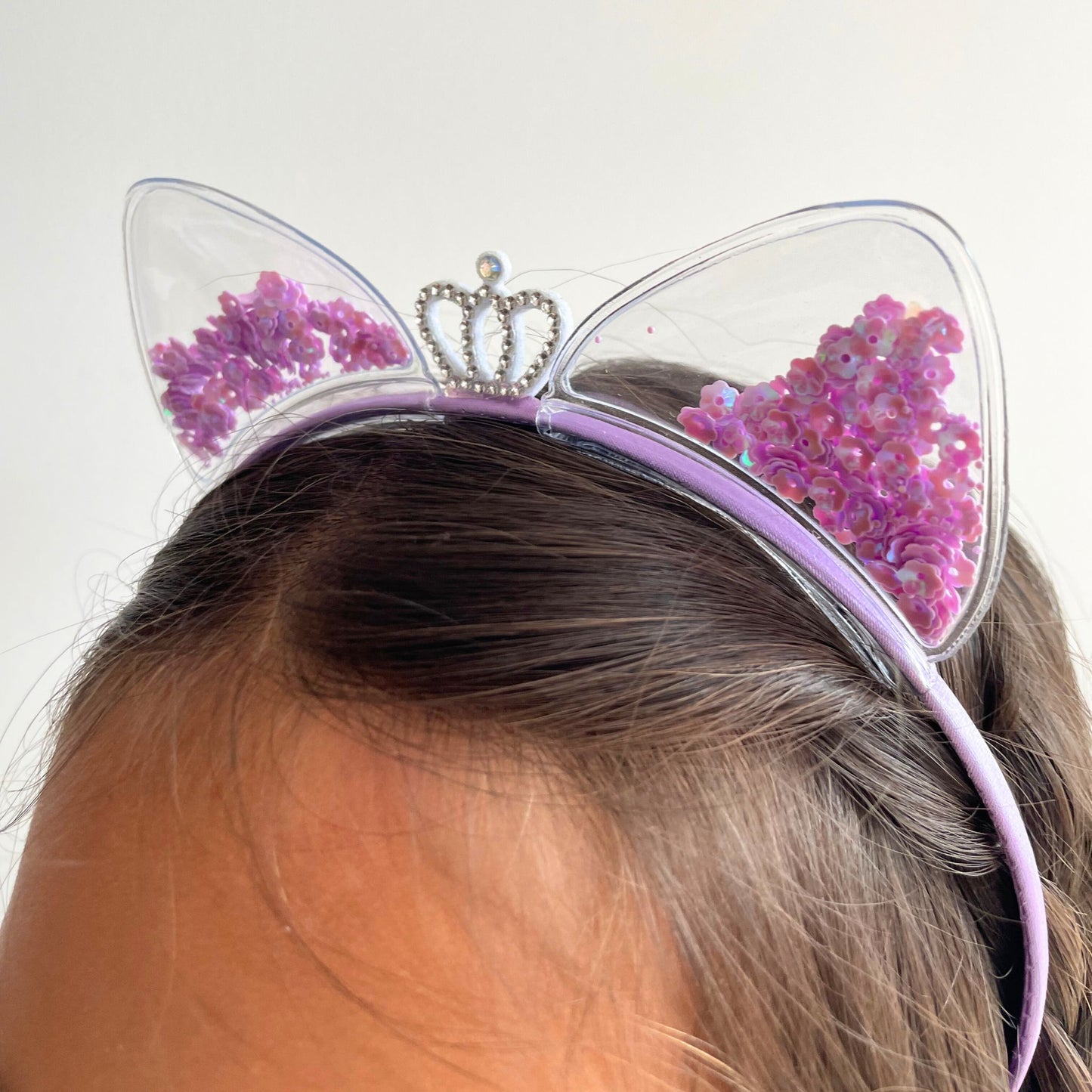 Clear cat ear headbands filled with colorful confetti, perfect for parties, festivals, or adding sparkle to everyday outfits.