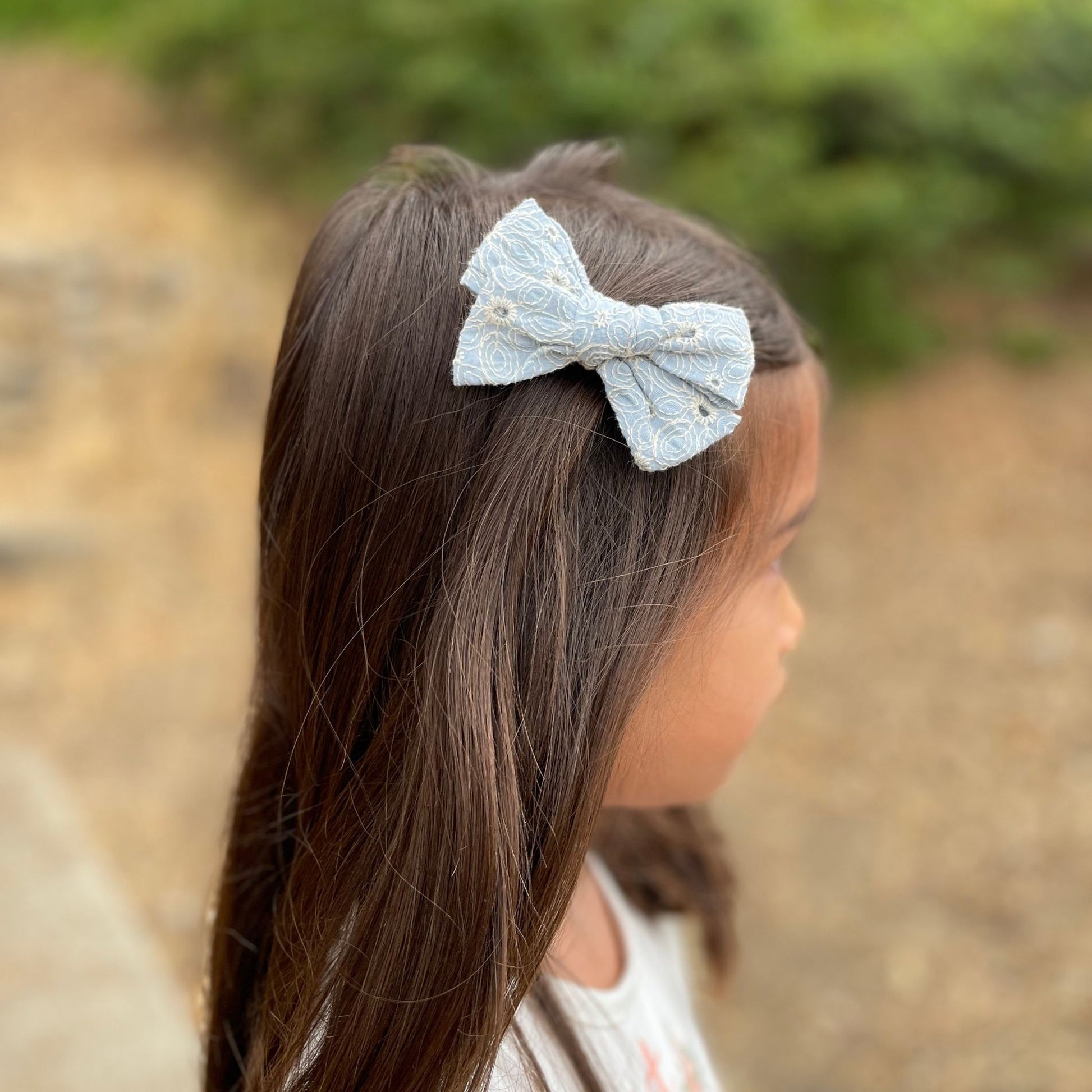 Kids boho hair bow clips in soft, earthy tones, ideal for adding a stylish and playful accent to everyday looks.