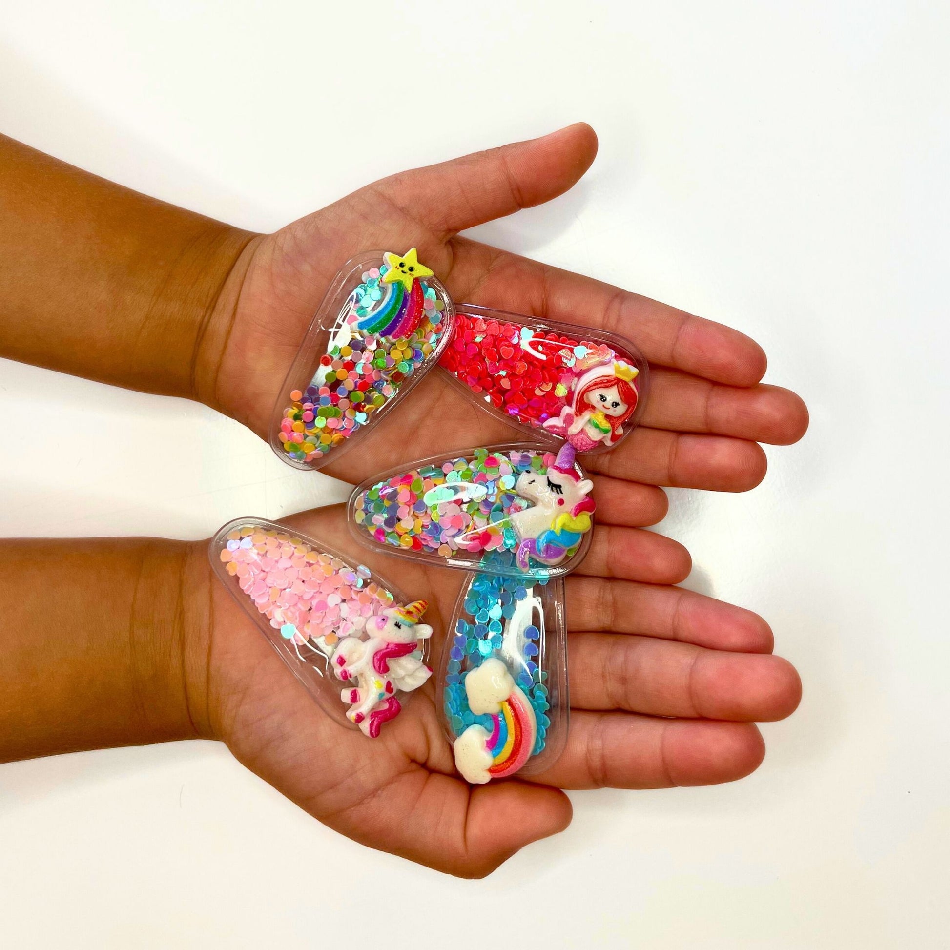 Colorful kids hair clips are fun. Swirling confetti makes it a perfect hair accessory for any occasion.