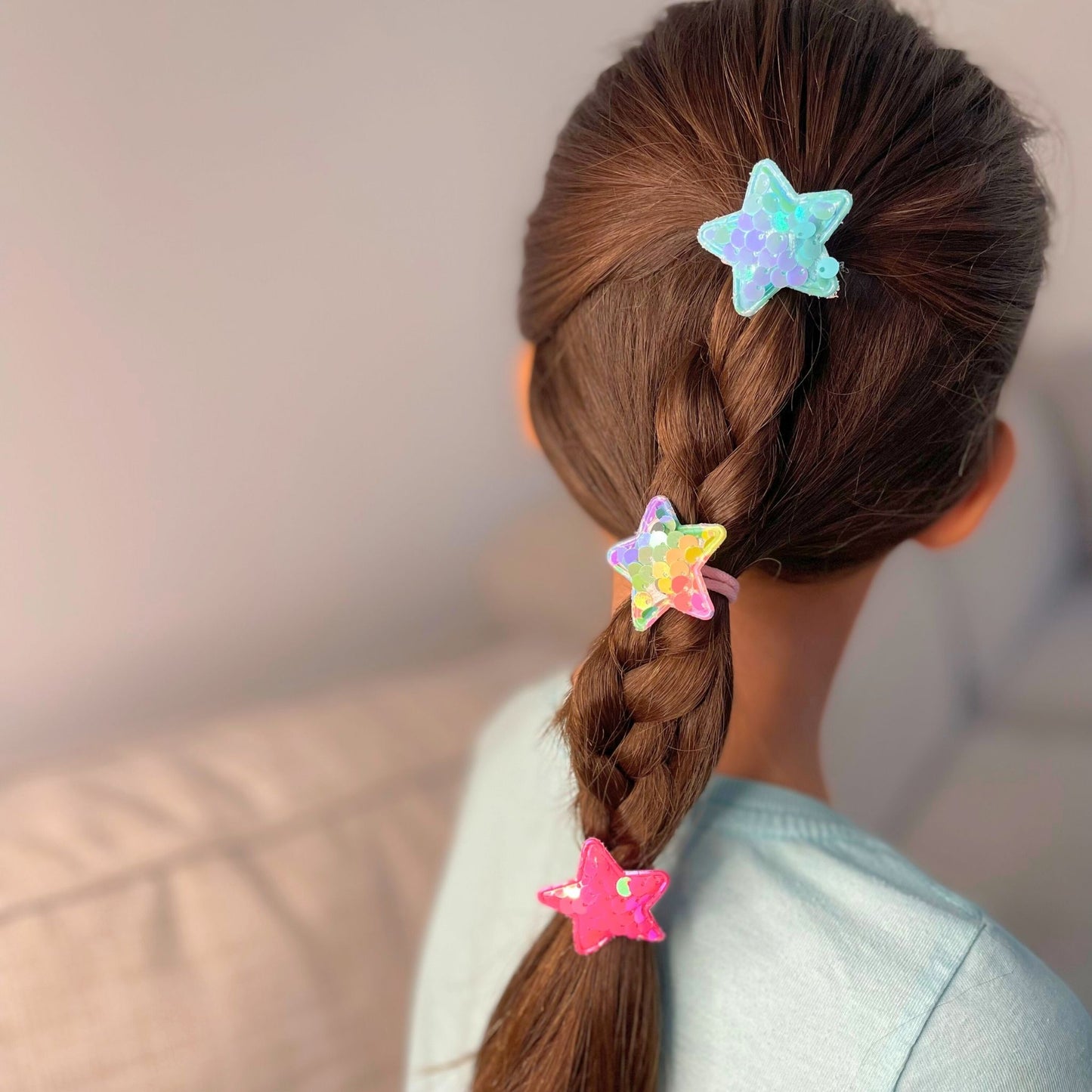 Kids star sequin hair tie, a fun and vibrant accessory to brighten up any hairstyle and outfit.