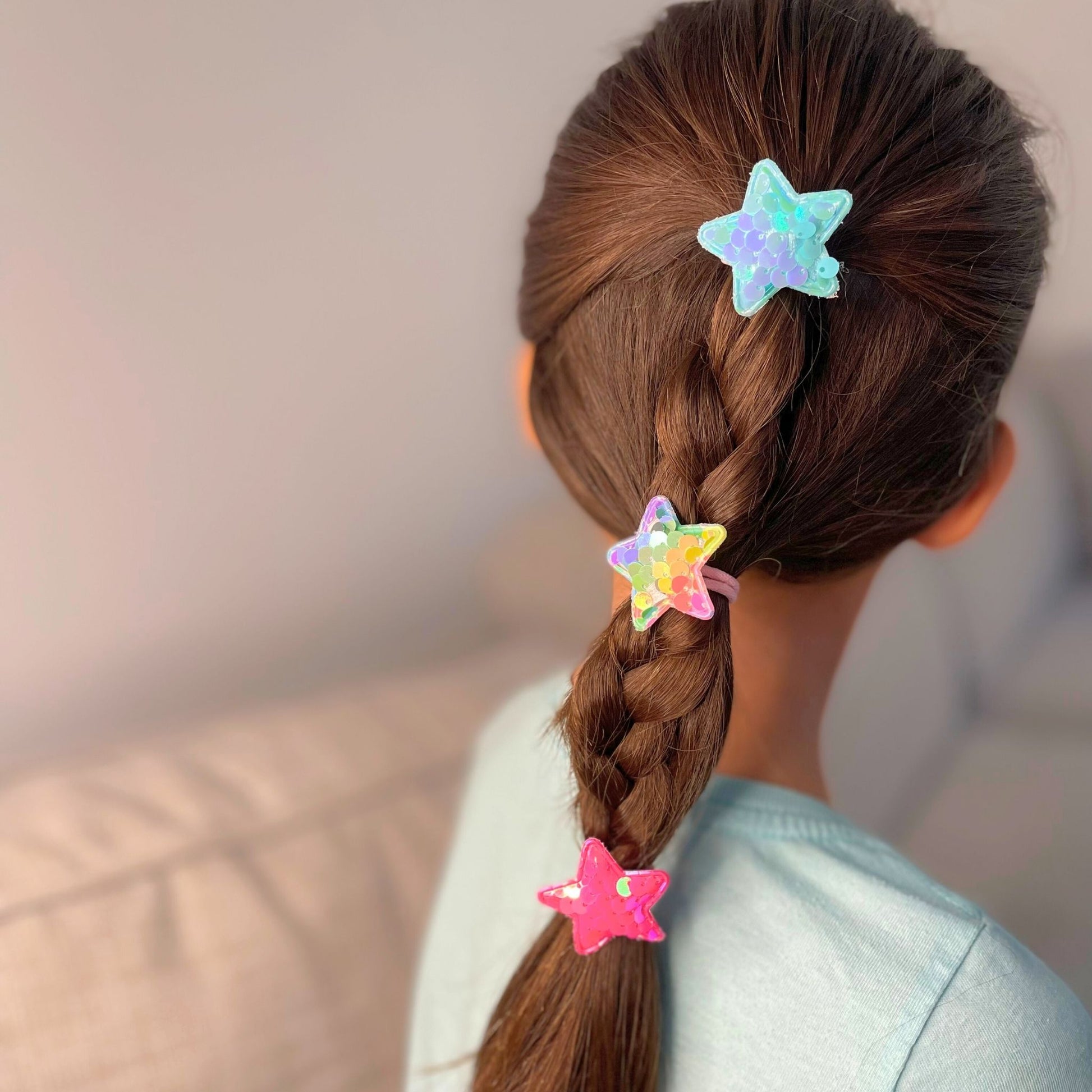 Kids star sequin hair tie, a fun and vibrant accessory to brighten up any hairstyle and outfit.