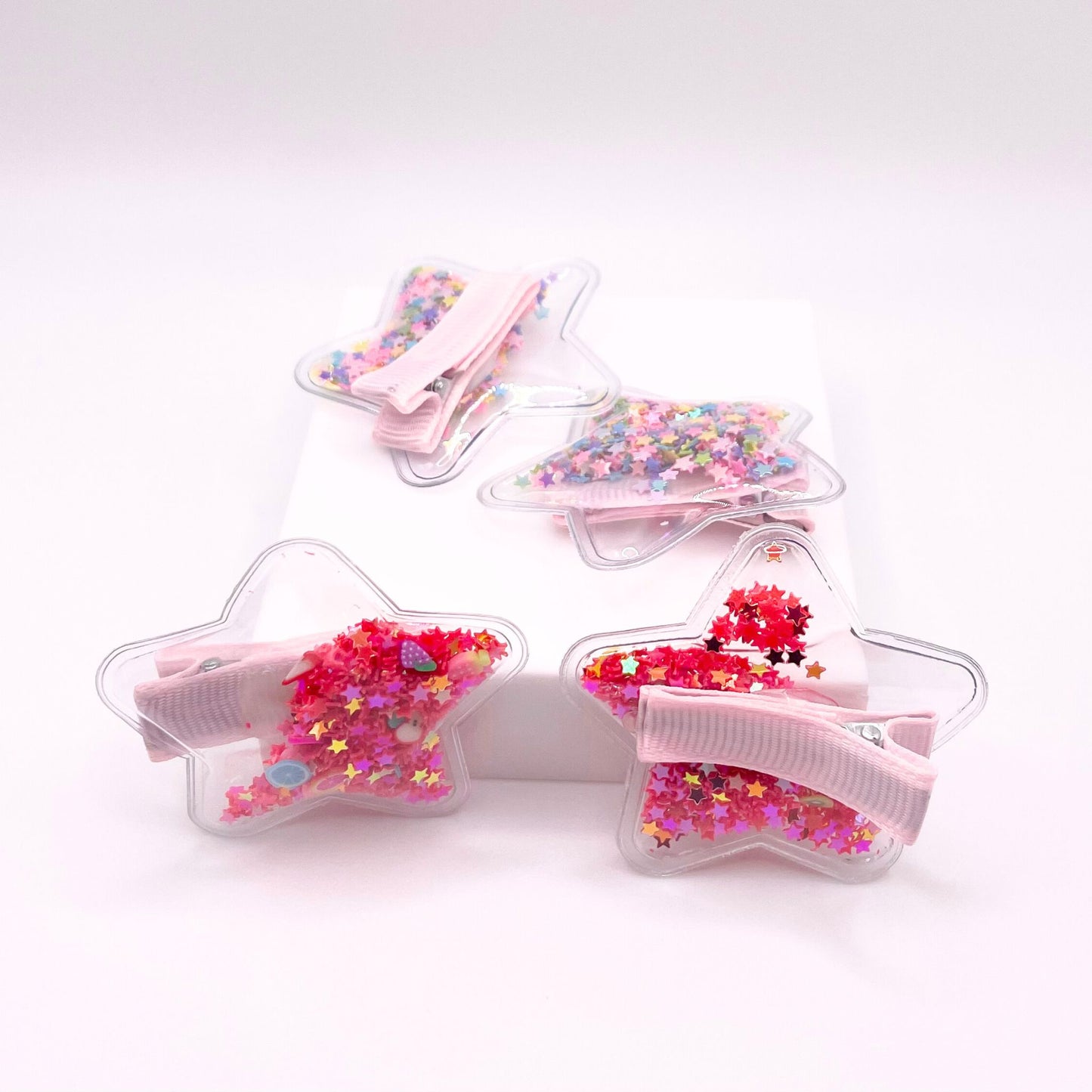 Add a cute touch to your hairstyle with our confetti star hair clips, featuring sparkling star designs that provide a secure hold and a playful flair.
