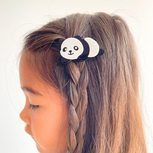 Cute panda hair accessory designed to securely hold hair while adding charm to any outfit.