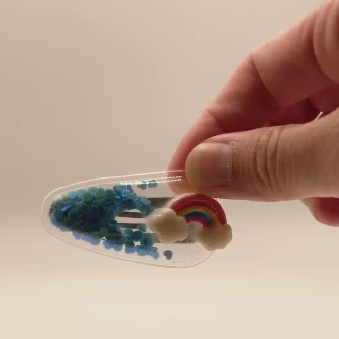 Filled with colorful confetti, this hair clip adds a touch of fun and sparkle to any hairstyle.