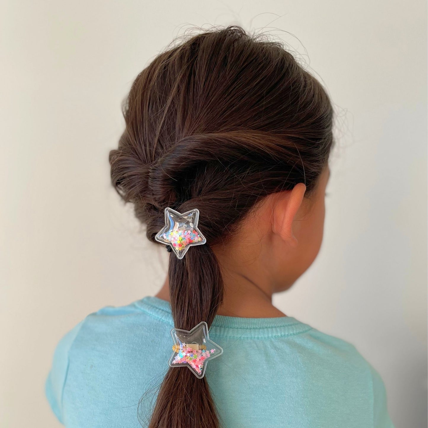 Kids confetti star hair tie with shiny stars, a fun accessory for trendy, colorful ponytails and casual or special occasions.