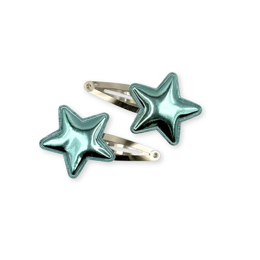Shiny star-shaped hair clips in metallic finishes, great for parties, school, or playful everyday hairstyles.