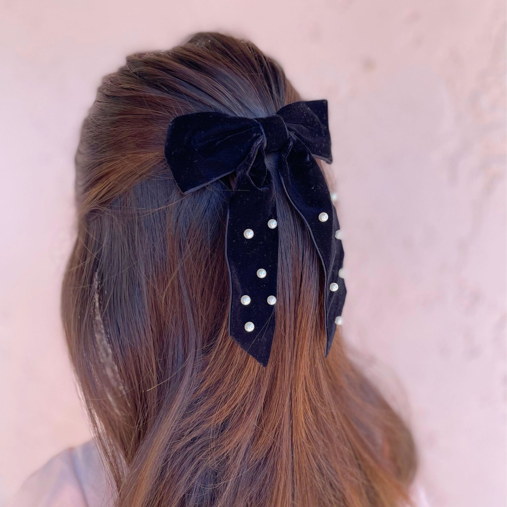 Fancy kids velvet hair bow with pearl accents, perfect for adding a touch of sophistication to any hairstyle.