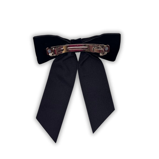 Velvet hair bow, adding a classic and chic look. Great accessory for school, parties, or casual outings.