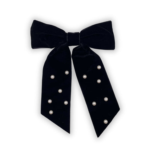 Fancy velvet hair bow with pearl accents, perfect for adding a touch of sophistication to any hairstyle.